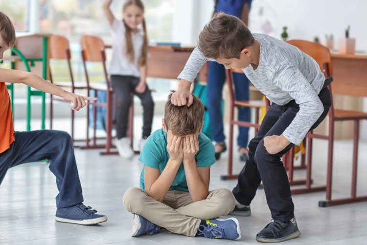 Why do schoolchildren often show aggression?